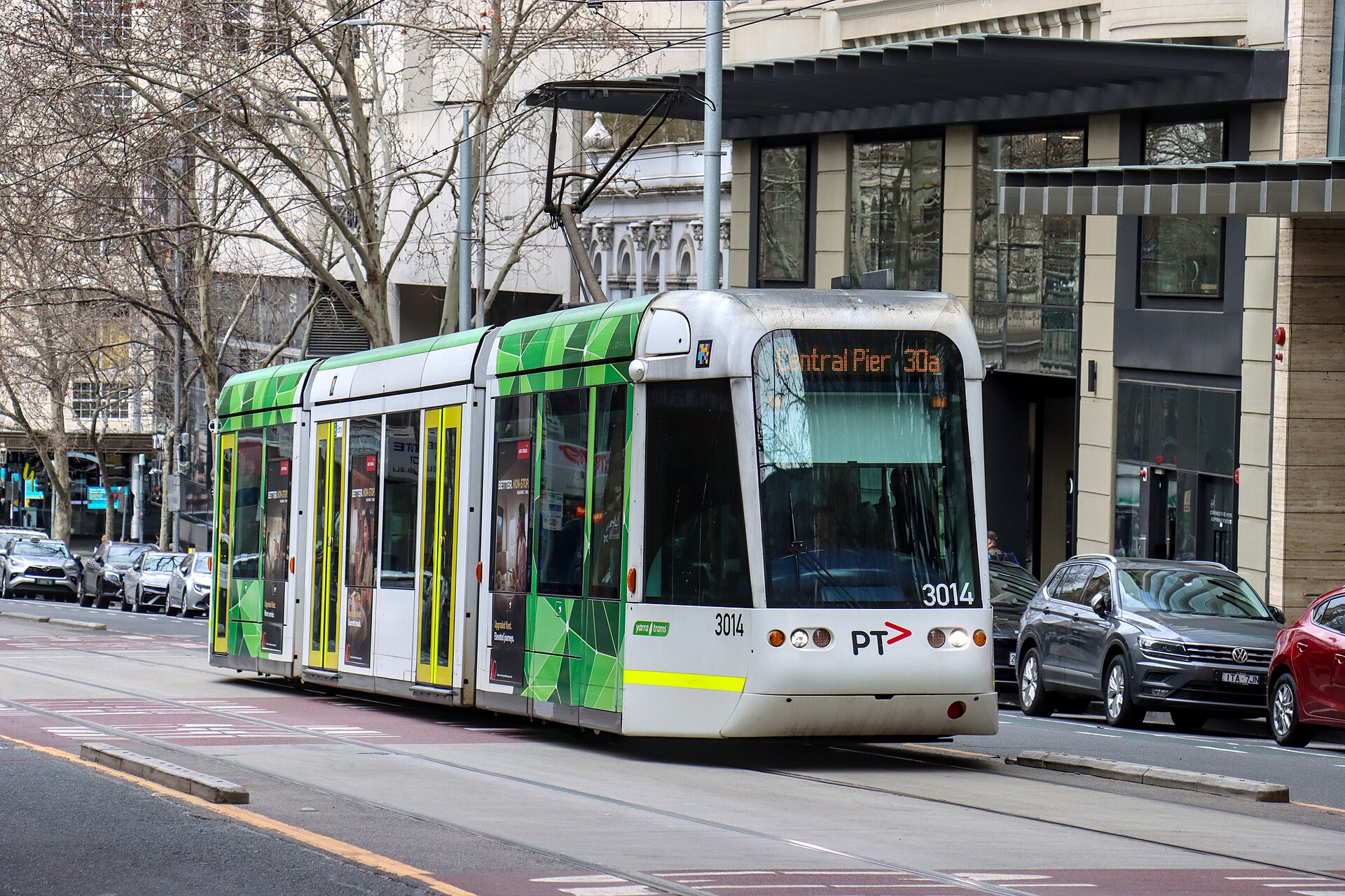 C1 class tram number 3014 in PTV livery operating a route 30a service to Central Pier Docklands diverting alon